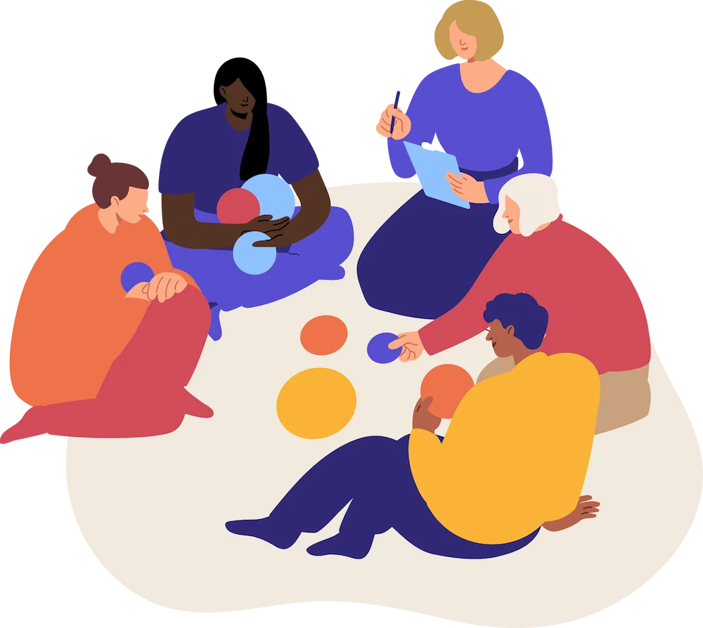 A group of people engaged in a coaching session